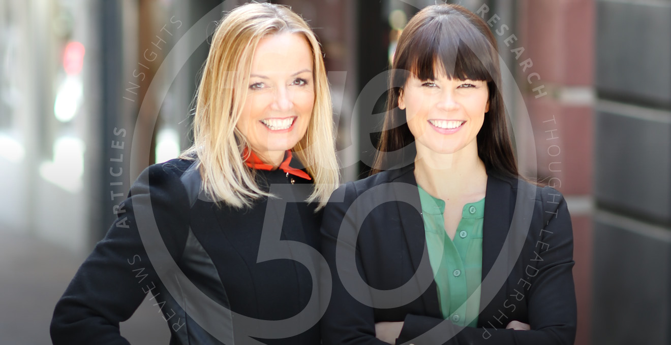 Two Women Co-founders of Fuel50 smiling in street