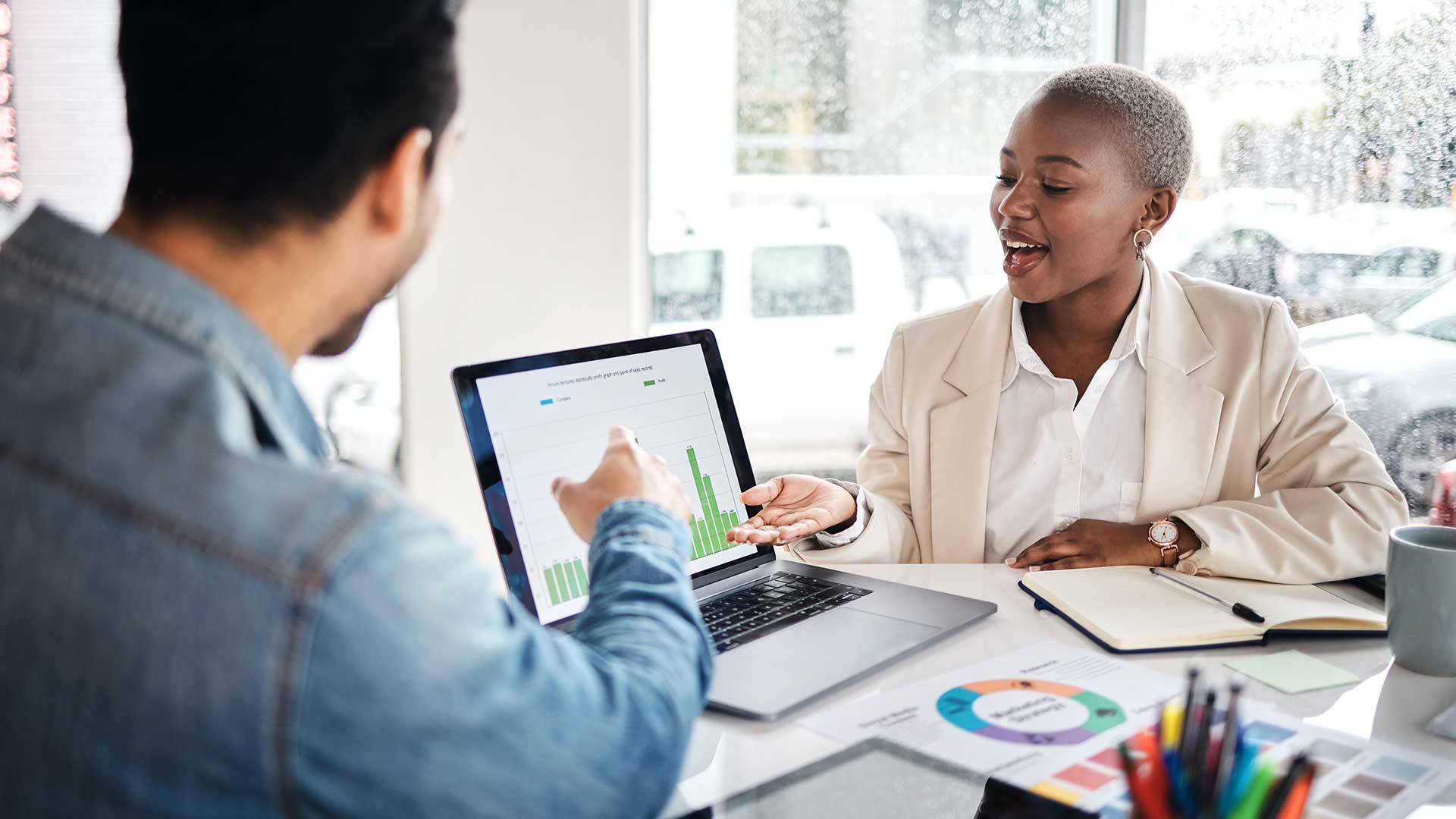 Skills Architecture - African American woman and Asian man working in office together, reviewing their Skills Architecture